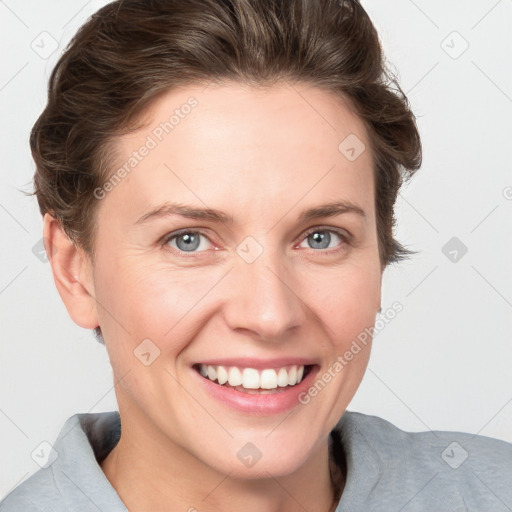 Joyful white young-adult female with short  brown hair and grey eyes