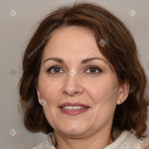 Joyful white adult female with medium  brown hair and brown eyes