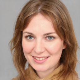 Joyful white young-adult female with medium  brown hair and blue eyes