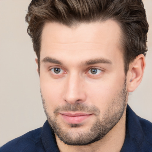 Joyful white young-adult male with short  brown hair and brown eyes