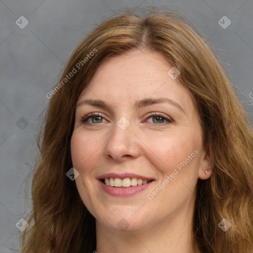 Joyful white adult female with long  brown hair and brown eyes