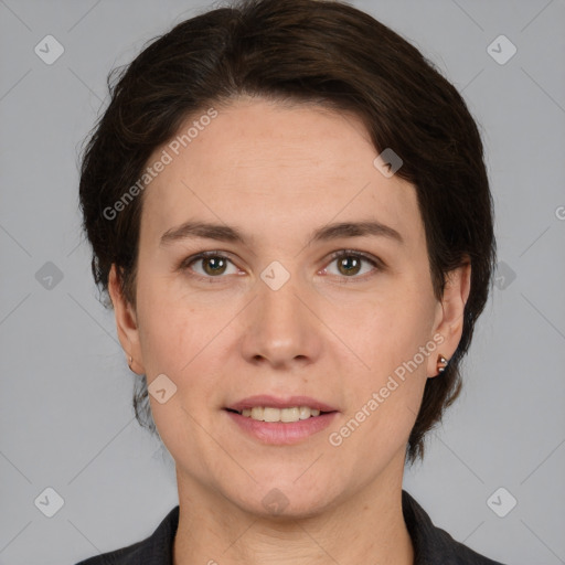 Joyful white adult female with medium  brown hair and brown eyes