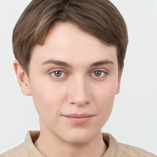 Joyful white young-adult female with short  brown hair and grey eyes