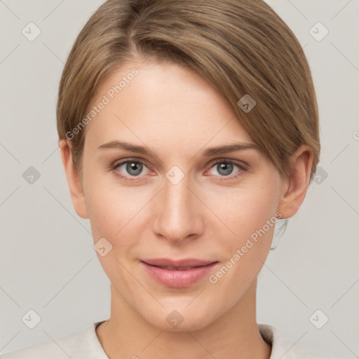 Joyful white young-adult female with short  brown hair and grey eyes