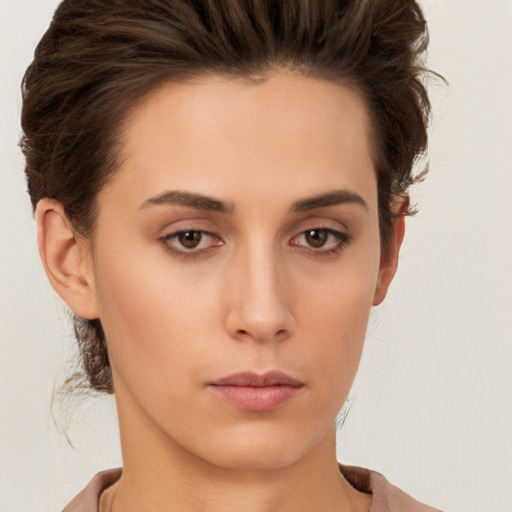 Neutral white young-adult female with short  brown hair and brown eyes