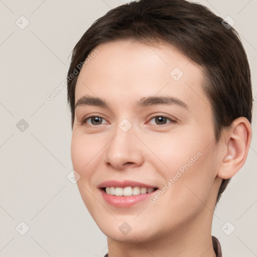 Joyful white young-adult female with short  brown hair and brown eyes