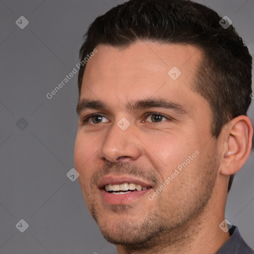 Joyful white young-adult male with short  brown hair and brown eyes