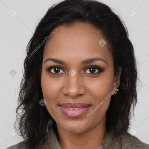 Joyful black young-adult female with long  brown hair and brown eyes