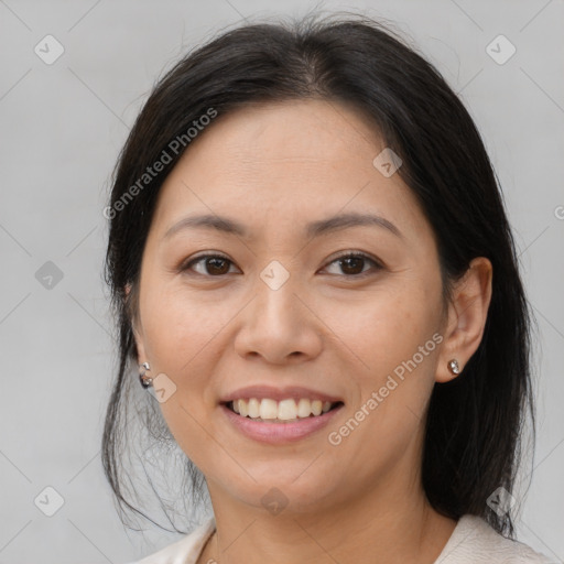 Joyful asian young-adult female with medium  brown hair and brown eyes