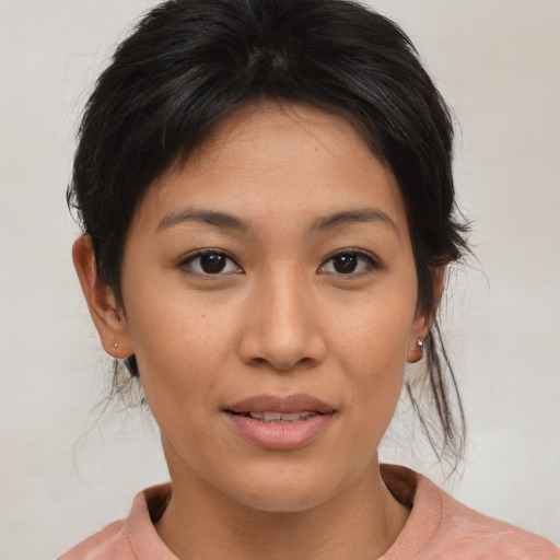Joyful asian young-adult female with medium  brown hair and brown eyes