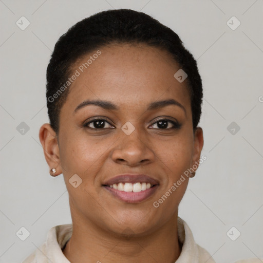 Joyful black young-adult female with short  black hair and brown eyes