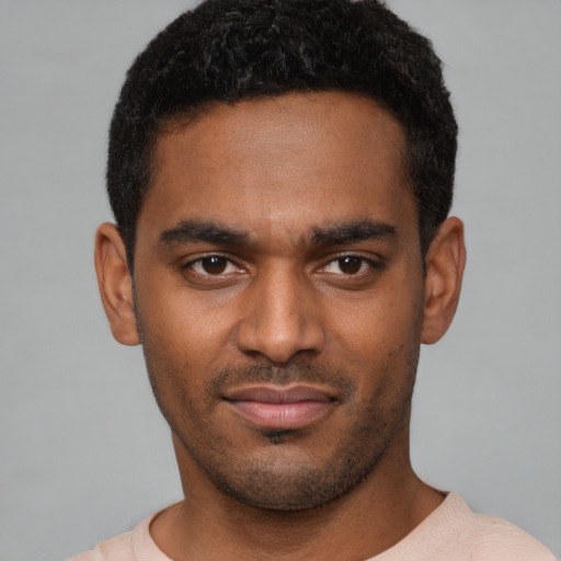 Neutral black young-adult male with short  black hair and brown eyes