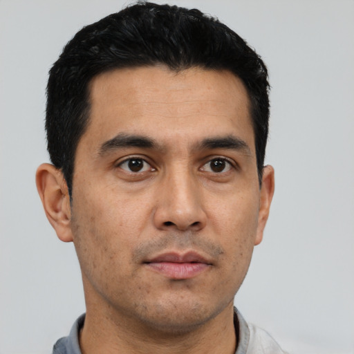 Neutral latino young-adult male with short  black hair and brown eyes