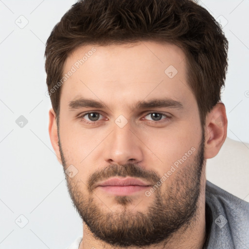 Neutral white young-adult male with short  brown hair and brown eyes