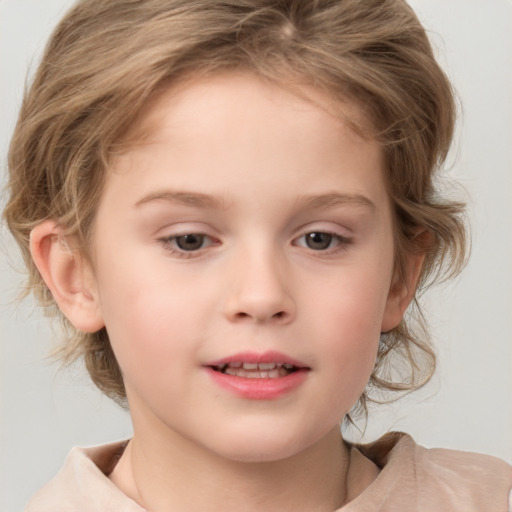 Joyful white child female with medium  brown hair and grey eyes