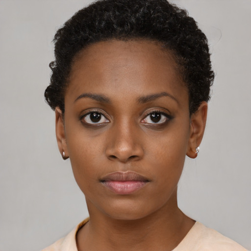 Neutral black young-adult female with short  brown hair and brown eyes