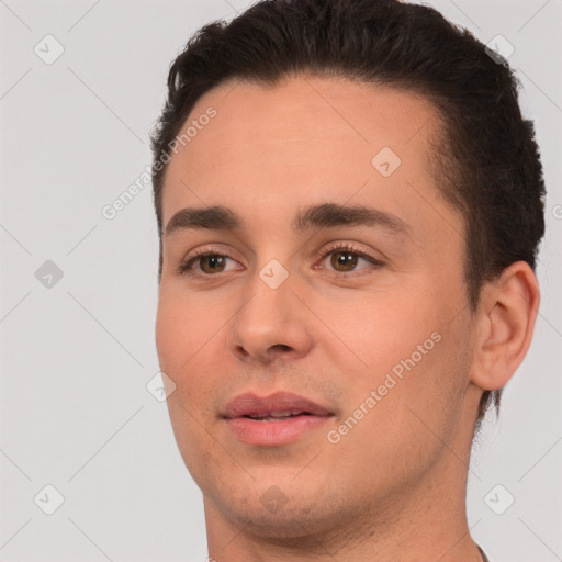 Joyful white young-adult male with short  brown hair and brown eyes