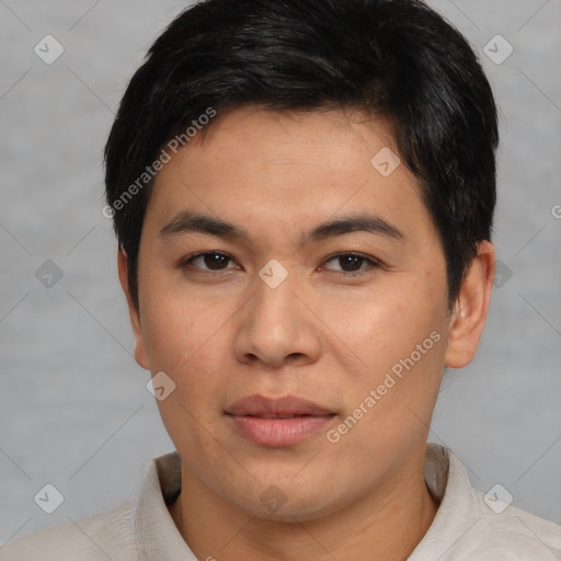 Joyful asian young-adult male with short  brown hair and brown eyes