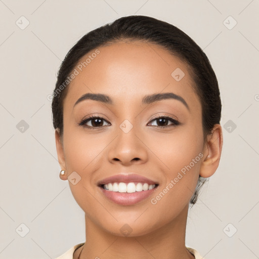 Joyful latino young-adult female with long  brown hair and brown eyes