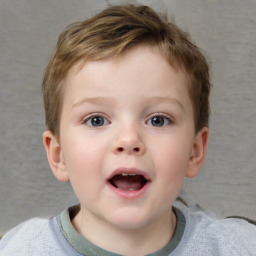 Joyful white child male with short  brown hair and blue eyes