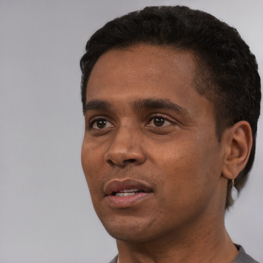 Neutral black young-adult male with short  black hair and brown eyes