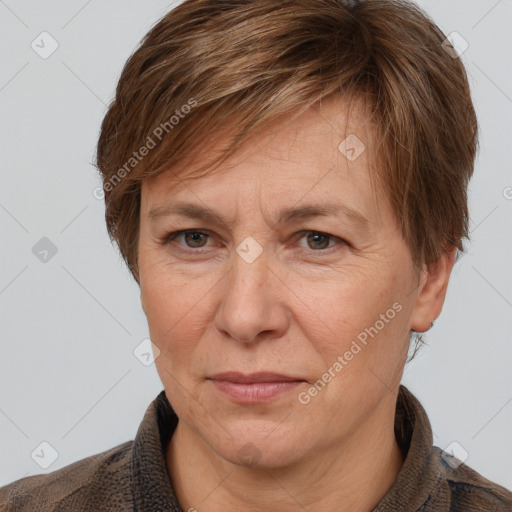 Joyful white adult female with short  brown hair and grey eyes