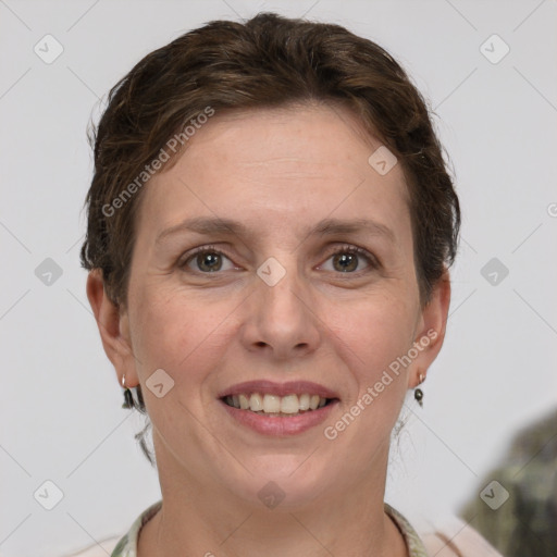 Joyful white adult female with short  brown hair and grey eyes