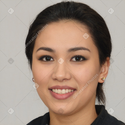 Joyful latino young-adult female with long  brown hair and brown eyes