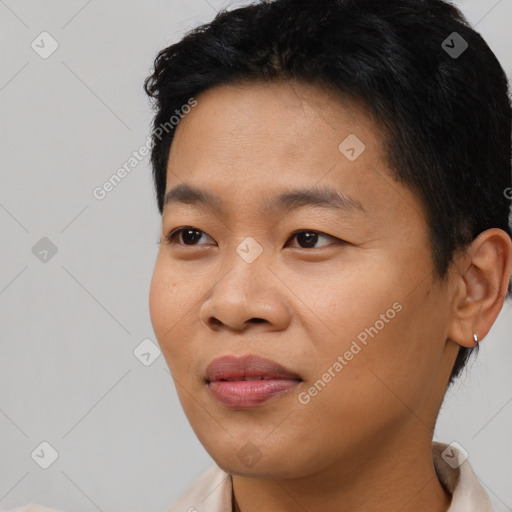 Joyful asian young-adult male with short  black hair and brown eyes