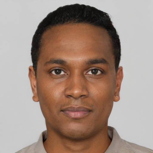 Neutral black young-adult male with short  black hair and brown eyes