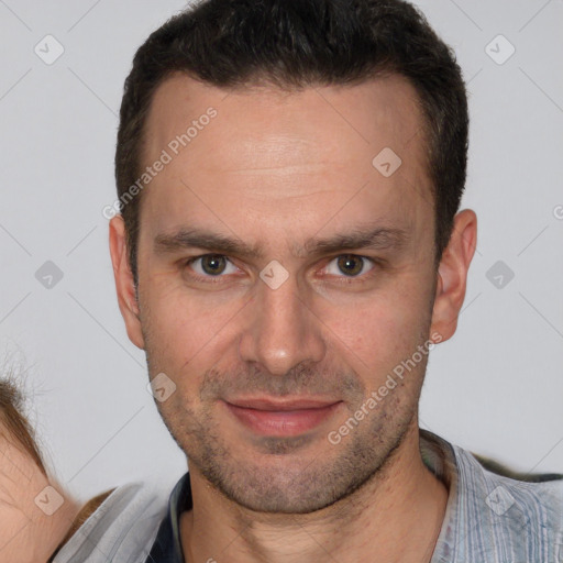 Joyful white adult male with short  brown hair and brown eyes