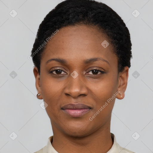 Joyful black young-adult female with short  black hair and brown eyes