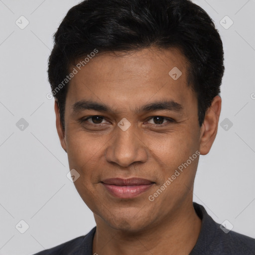 Joyful white young-adult male with short  black hair and brown eyes