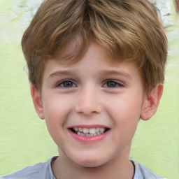 Joyful white child male with short  brown hair and brown eyes