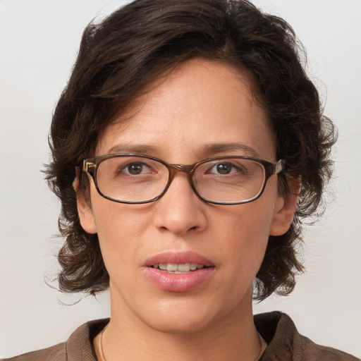 Joyful white young-adult female with medium  brown hair and blue eyes