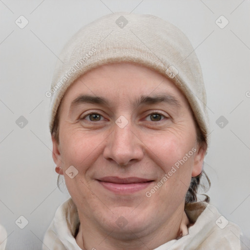 Joyful white adult male with short  brown hair and grey eyes