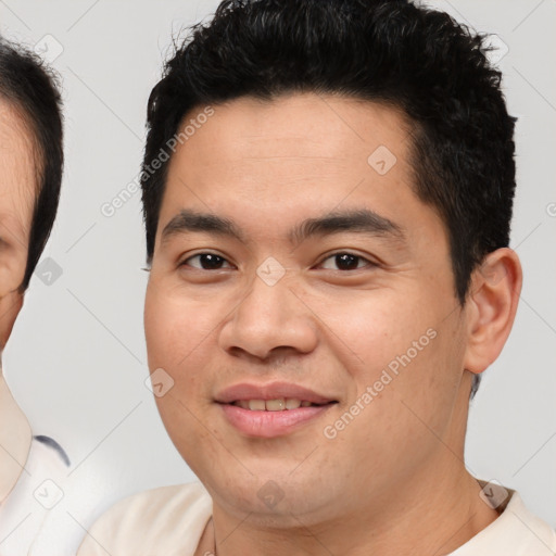 Joyful asian young-adult male with short  brown hair and brown eyes