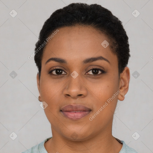 Joyful black young-adult female with short  black hair and brown eyes