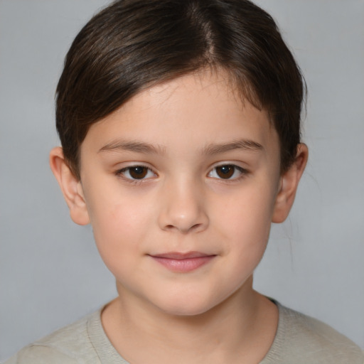 Joyful white child female with short  brown hair and brown eyes