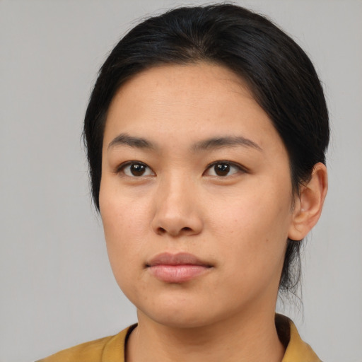 Neutral asian young-adult female with medium  black hair and brown eyes