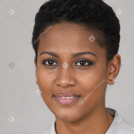 Joyful black young-adult female with short  brown hair and brown eyes