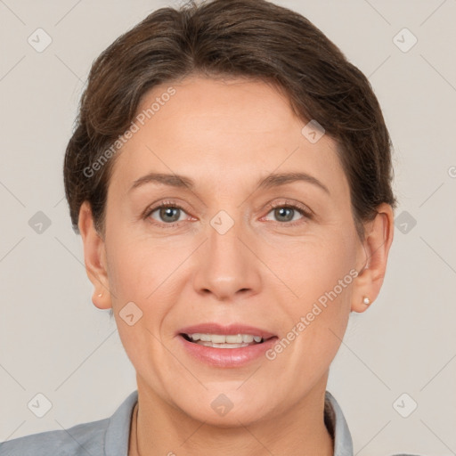 Joyful white adult female with short  brown hair and brown eyes