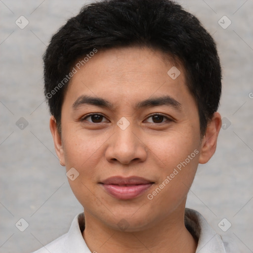 Joyful asian young-adult male with short  brown hair and brown eyes