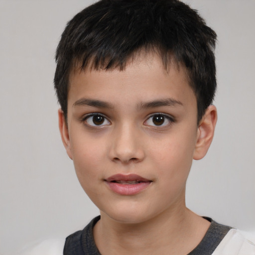 Joyful white child male with short  brown hair and brown eyes