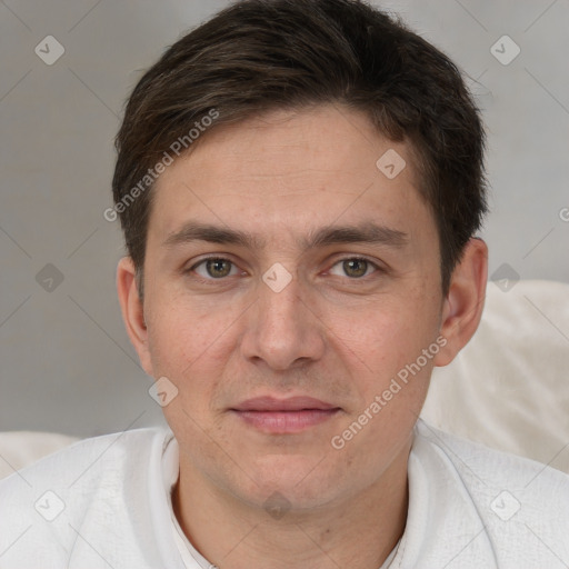 Joyful white adult male with short  brown hair and brown eyes