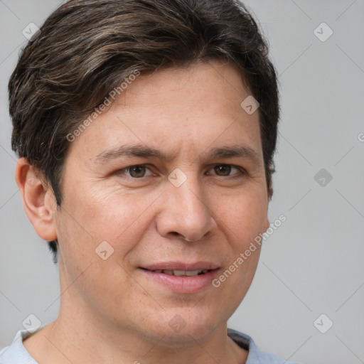 Joyful white adult male with short  brown hair and brown eyes