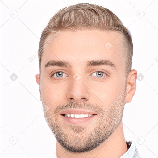 Joyful white young-adult male with short  brown hair and brown eyes