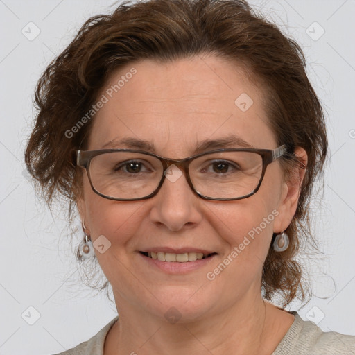 Joyful white adult female with medium  brown hair and brown eyes