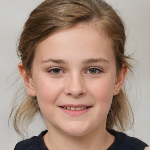 Joyful white child female with medium  brown hair and grey eyes