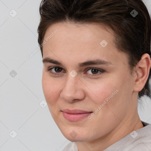 Joyful white young-adult female with short  brown hair and brown eyes